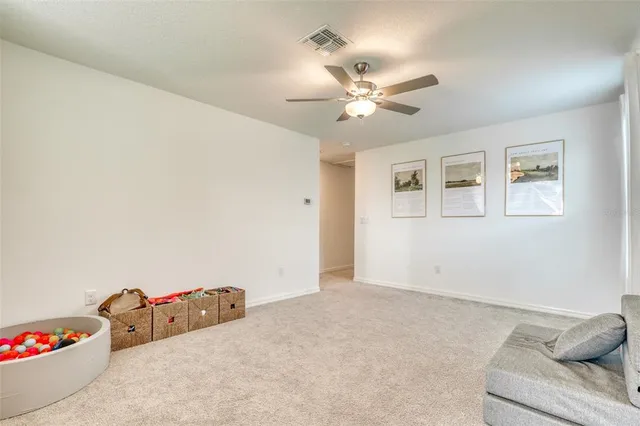 a kitchen with stainless steel appliances granite countertop a stove a sink a microwave a dining table and chairs