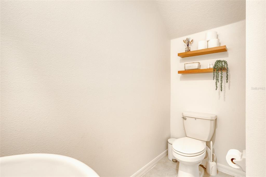 111 Rain Lily Ave Spring Hill Spring Hill, FL 34609 - Photo 35 of 60 a white toilet sitting next to a white wall