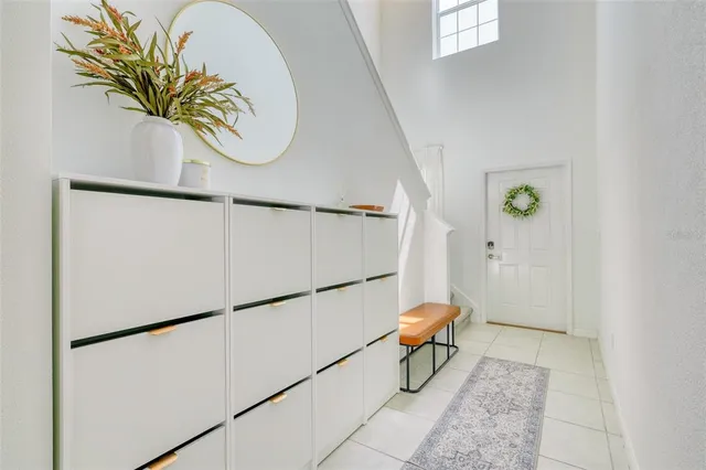 a bathroom with a granite countertop toilet and a sink