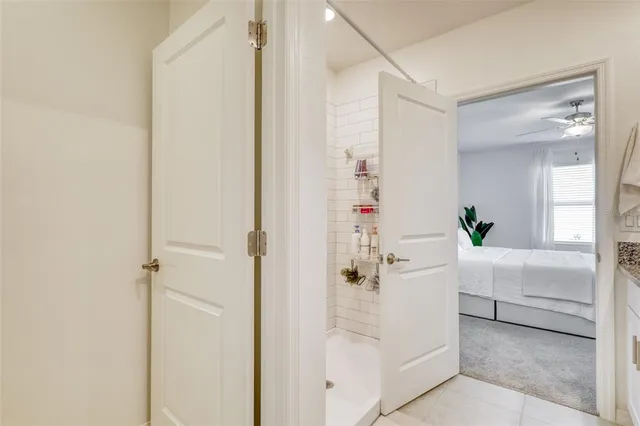 a front view of a house with a garden and plants