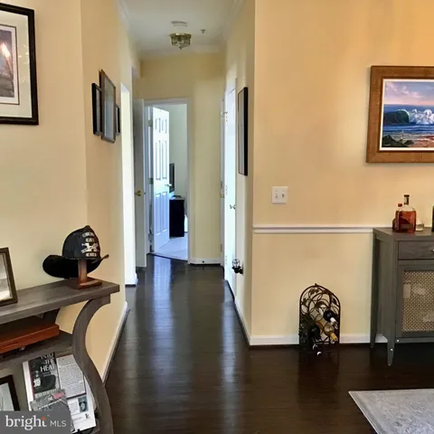 a view of a lobby with furniture and wooden floor