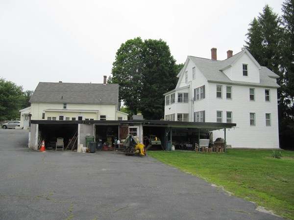 25 Fowler Road Northbridge, MA 01534 - Photo 8 of 30 a view of a house with a yard and a car parked in front of it