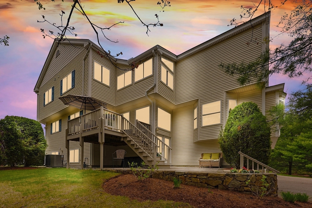 3002 Maple Brook Road, Unit 3002 Bellingham, MA 02019 - Photo 38 of 42 a front view of a house with a yard