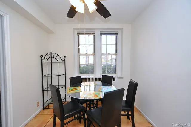 a view of a dining room with furniture and window