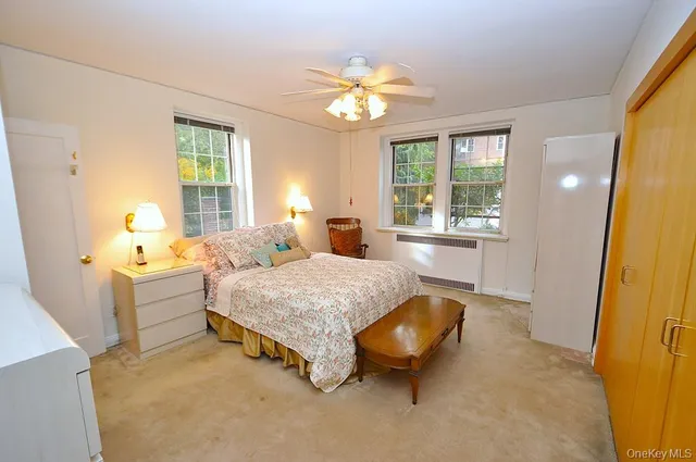 a spacious bedroom with a bed and a table