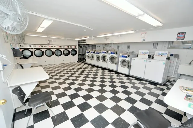 a storage room with lots of appliances and cabinets