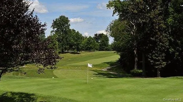 a view of a golf course with a garden