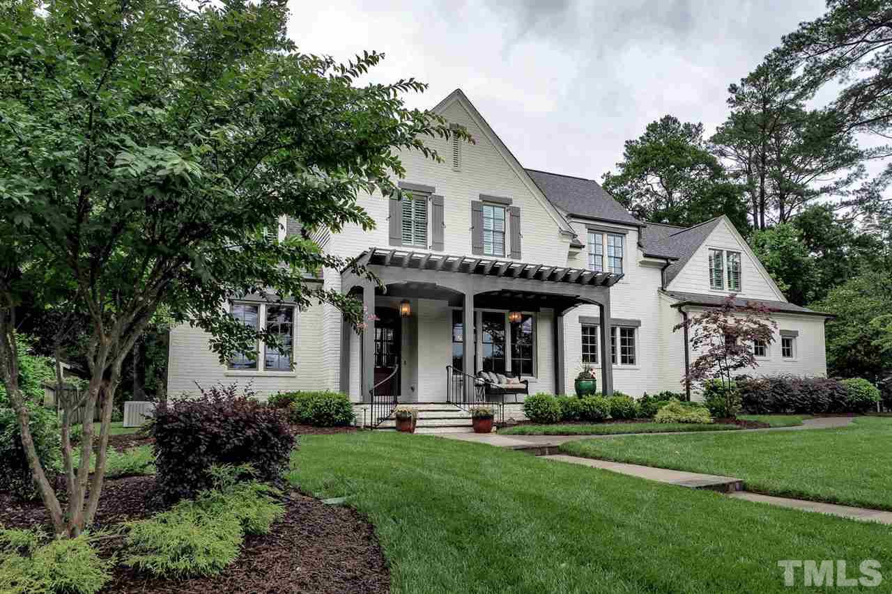 5005 Rampart Street Raleigh, NC 27609 - Photo 1 of 25 a view of house with yard and green space