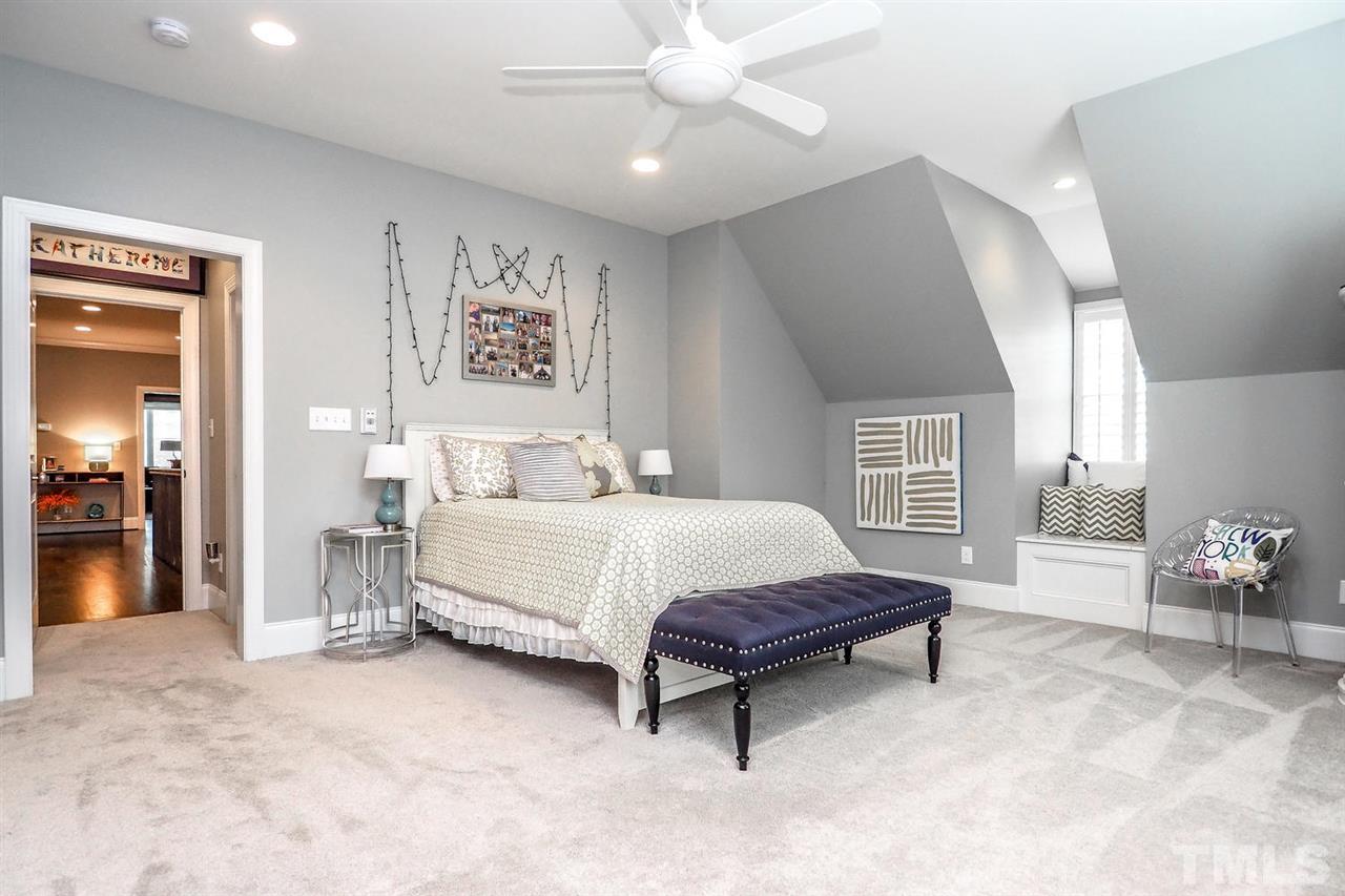 5005 Rampart Street Raleigh, NC 27609 - Photo 17 of 25 a spacious bedroom with a bed and window