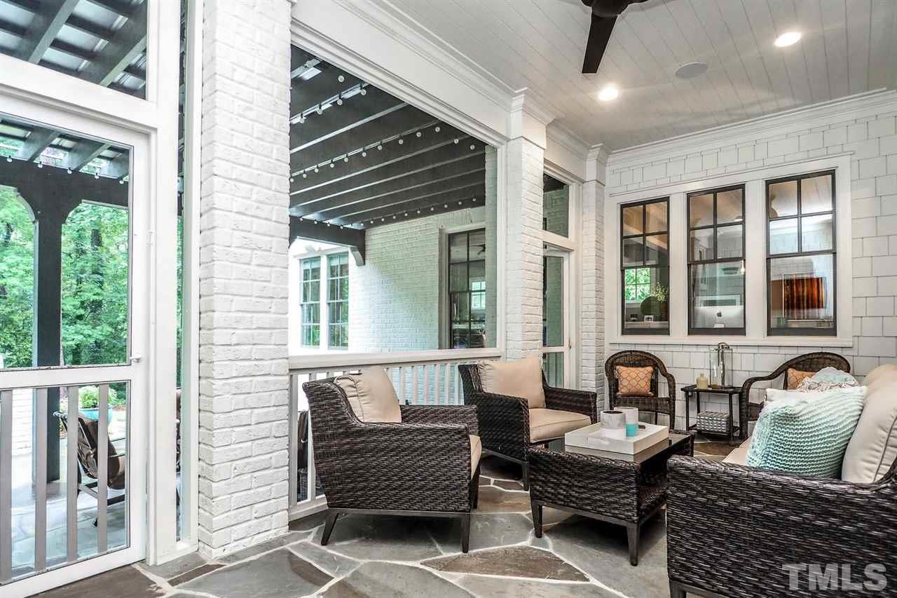 5005 Rampart Street Raleigh, NC 27609 - Photo 22 of 25 a balcony with furniture and a large window