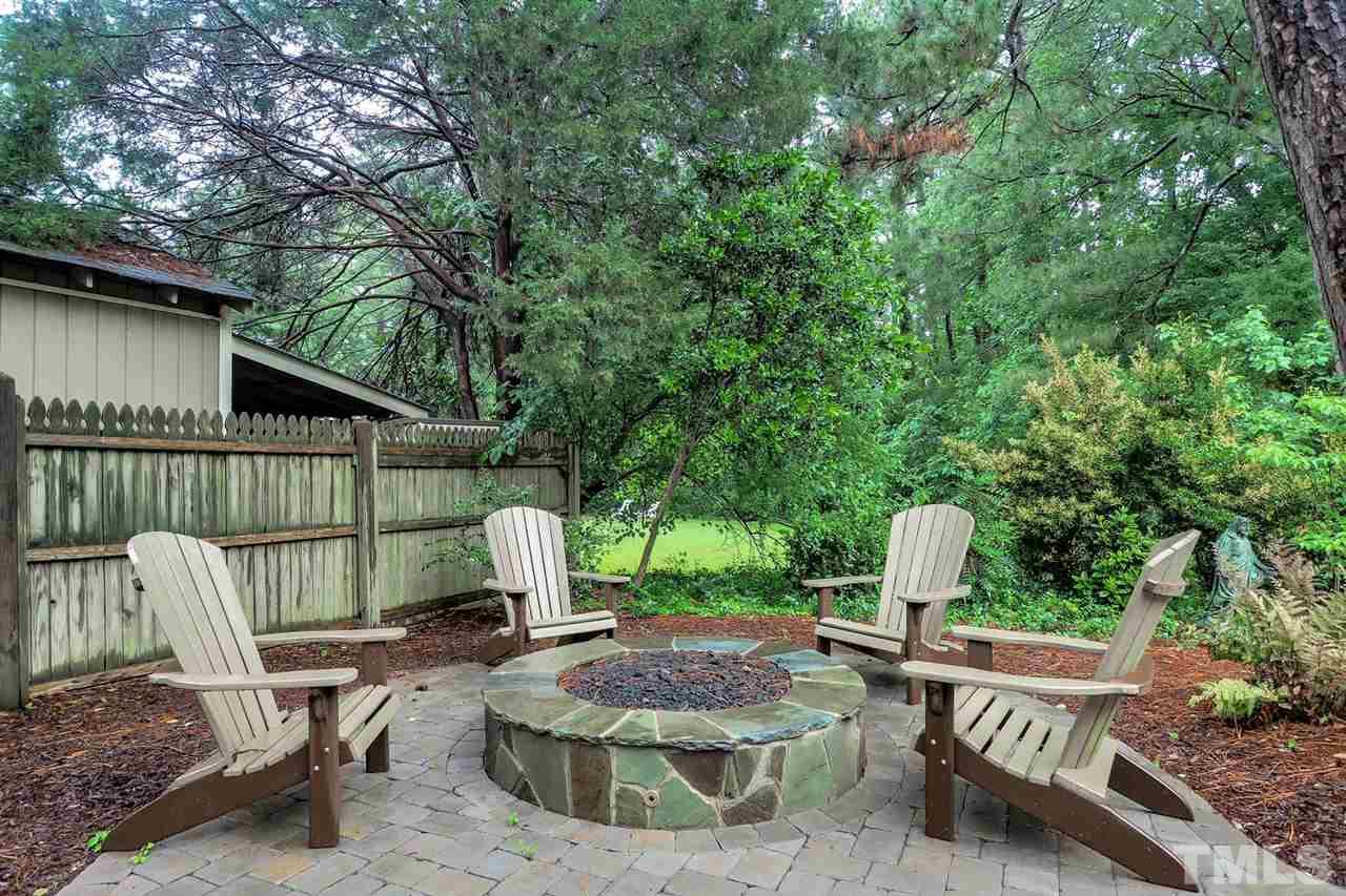 5005 Rampart Street Raleigh, NC 27609 - Photo 24 of 25 a view of backyard with deck and outdoor seating
