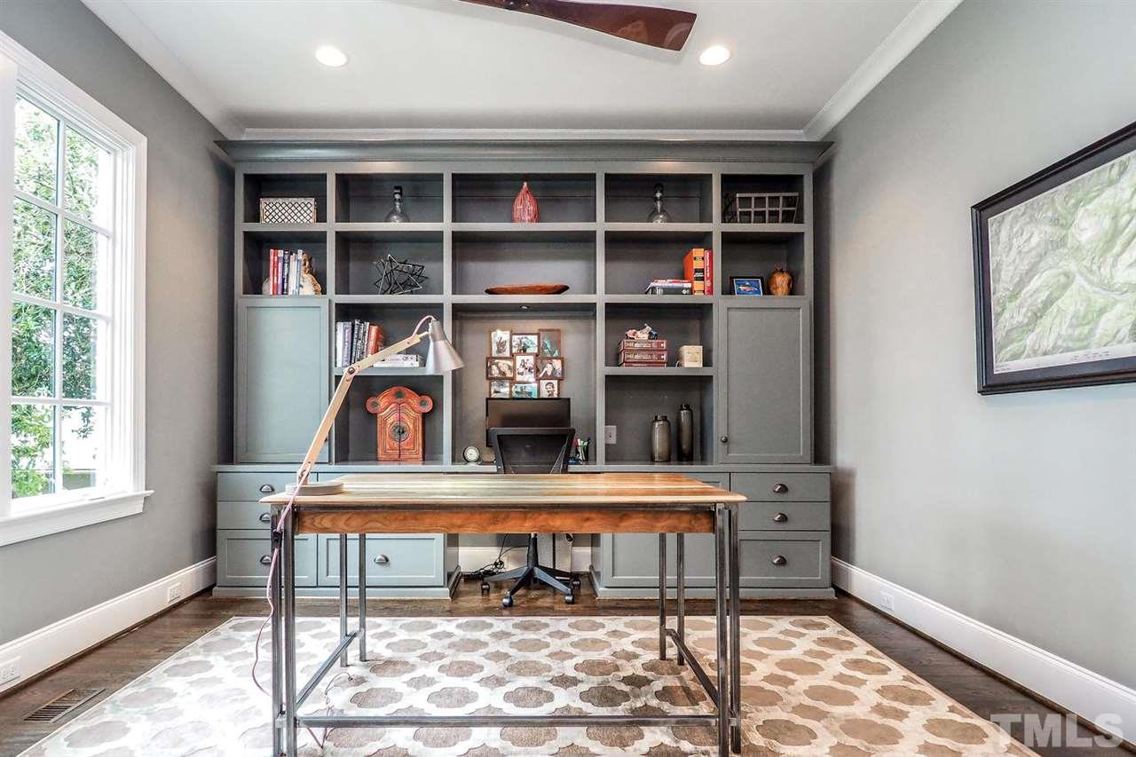5005 Rampart Street Raleigh, NC 27609 - Photo 5 of 25 a room with furniture and a book shelf