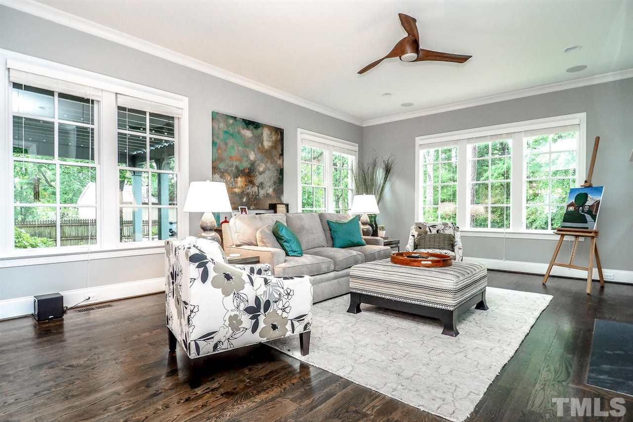 5005 Rampart Street Raleigh, NC 27609 - Photo 9 of 25 a living room with furniture and a large window