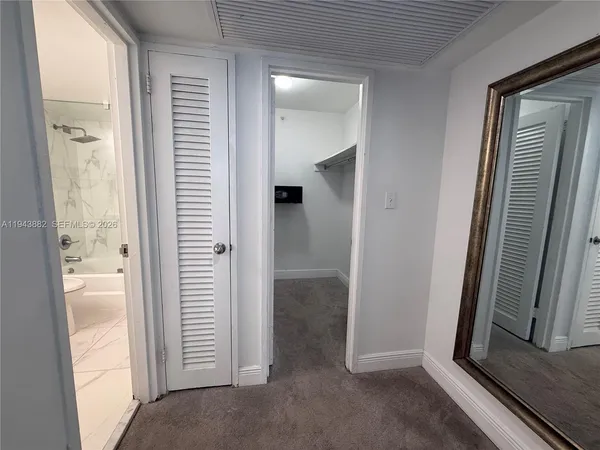 a kitchen with a sink appliances and cabinets