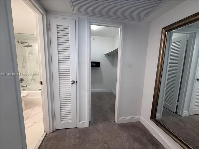 a kitchen with a sink appliances and cabinets