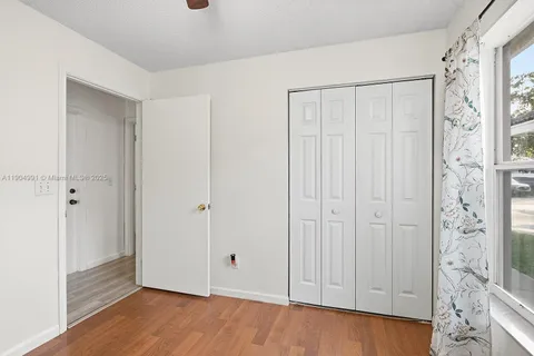 a view of a bathroom with wooden floor