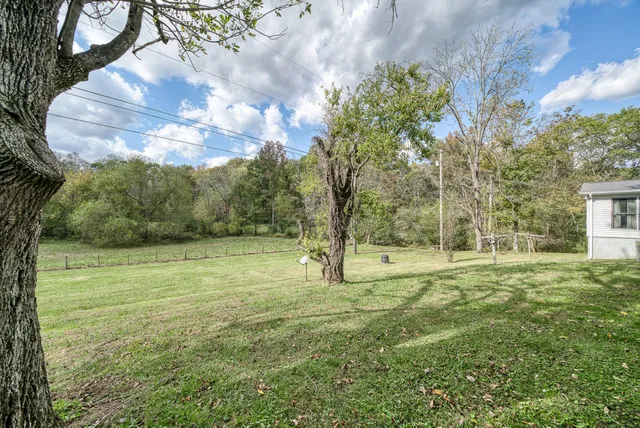 a kitchen with stainless steel appliances granite countertop a sink and a cabinets