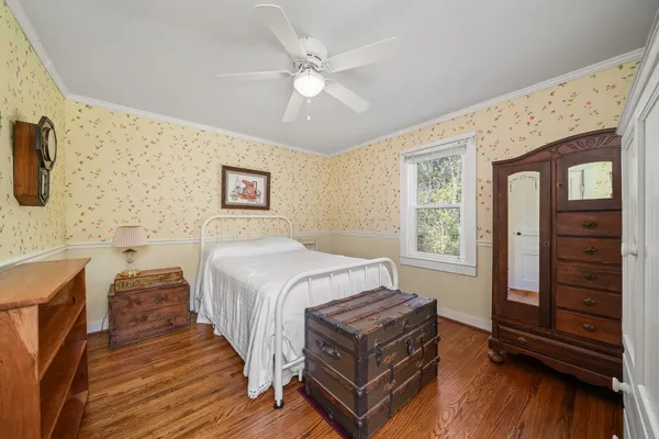 a bathroom with a sink a toilet a mirror and shower curtain