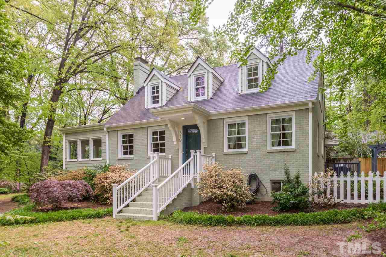319 Furches Street Raleigh, NC 27607 - Photo 1 of 25 a front view of a house with garden