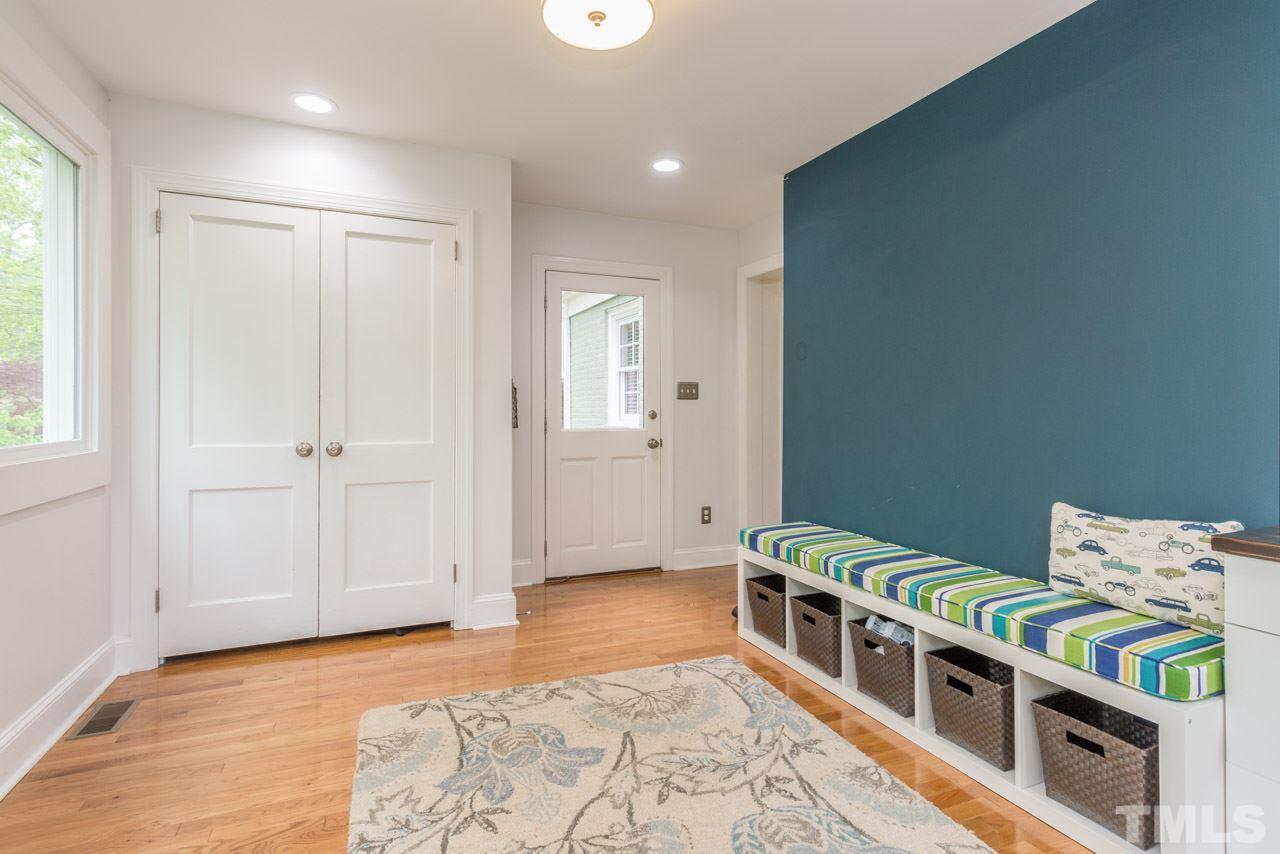 319 Furches Street Raleigh, NC 27607 - Photo 11 of 25 a hallway with a baby crib and a window