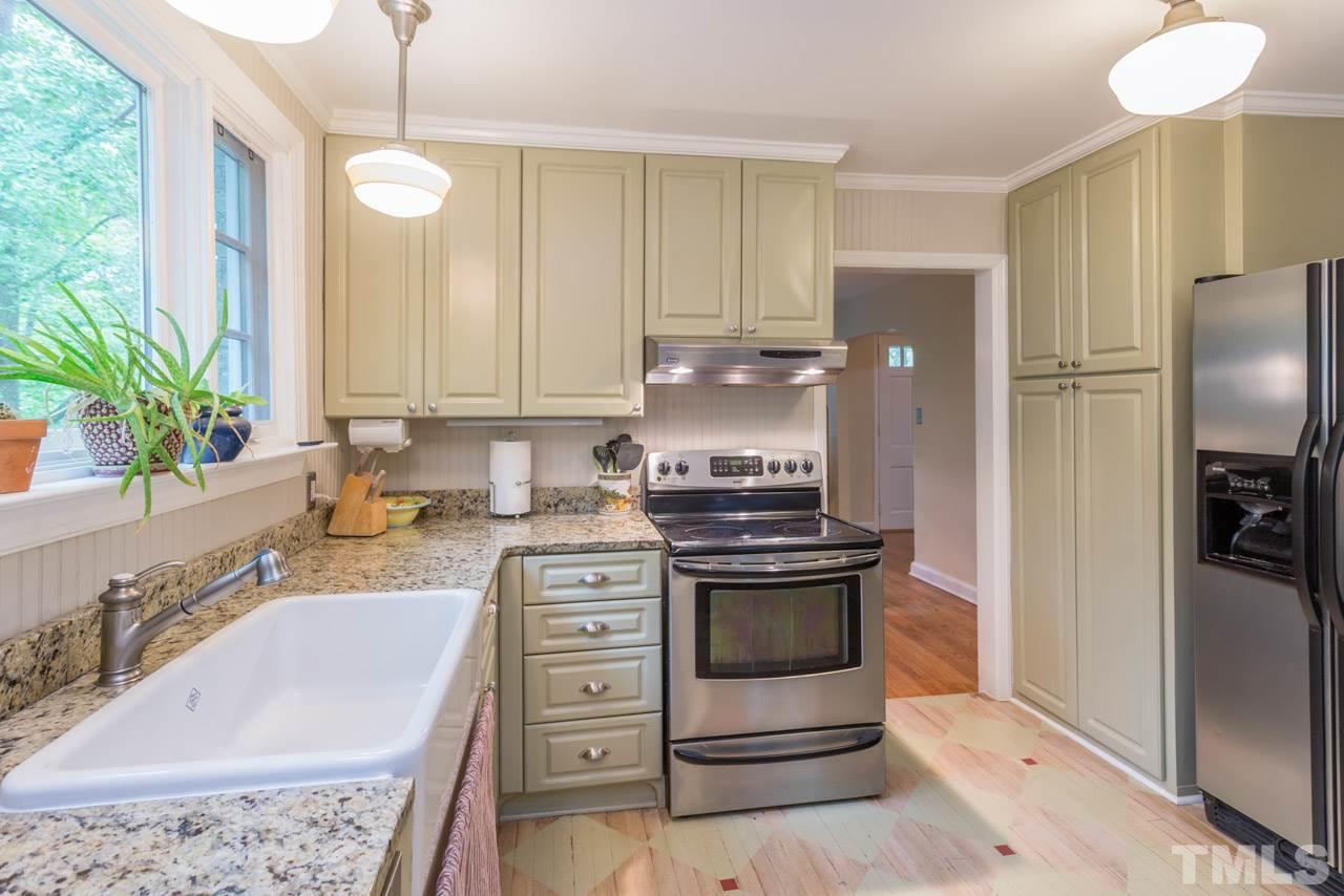 319 Furches Street Raleigh, NC 27607 - Photo 15 of 25 a kitchen with stainless steel appliances granite countertop a sink stove and refrigerator