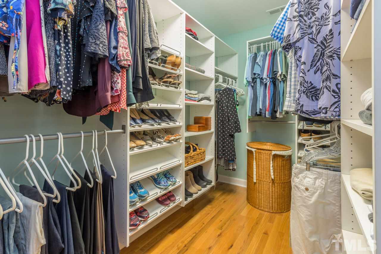 319 Furches Street Raleigh, NC 27607 - Photo 19 of 25 a view of walk in closet with clothes and shoes