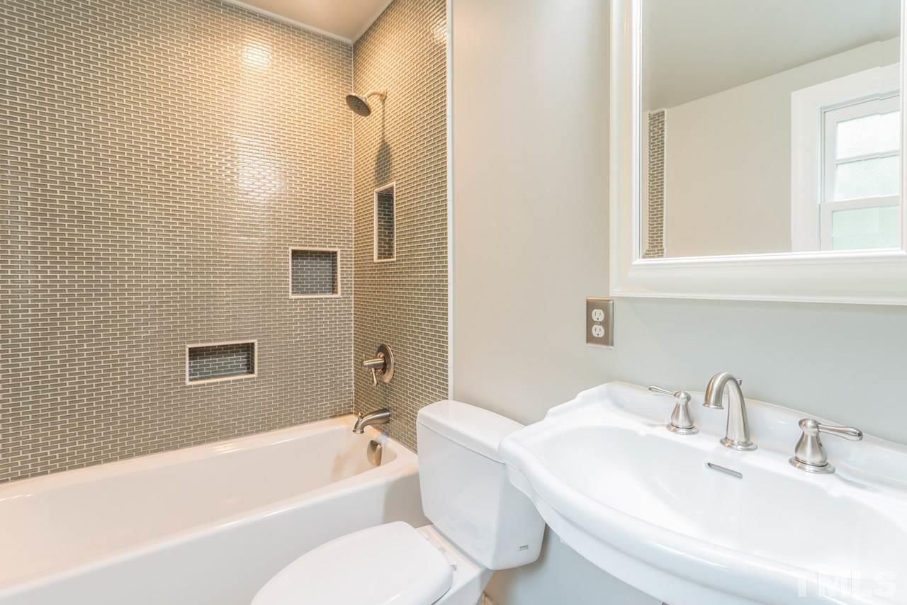 319 Furches Street Raleigh, NC 27607 - Photo 23 of 25 a bathroom with a sink toilet and bathtub