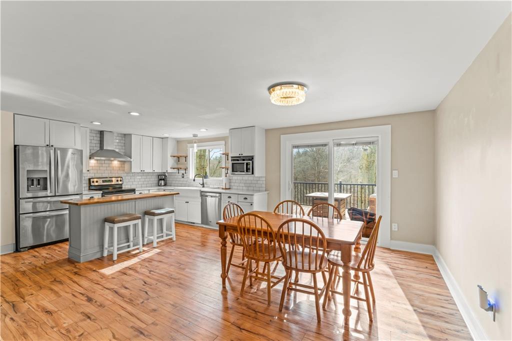 359 Hunting Creek Road Canonsburg, PA 15317 - Photo 11 of 39 a view of a dining room with furniture and wooden floor