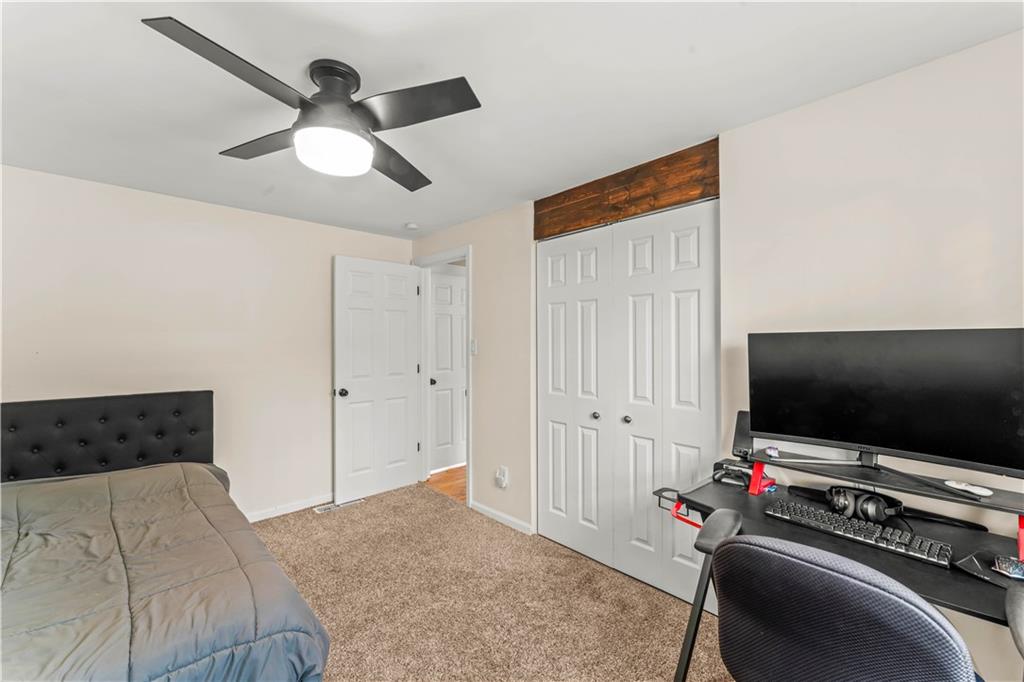 359 Hunting Creek Road Canonsburg, PA 15317 - Photo 18 of 39 a bedroom with a bed and a flat screen tv