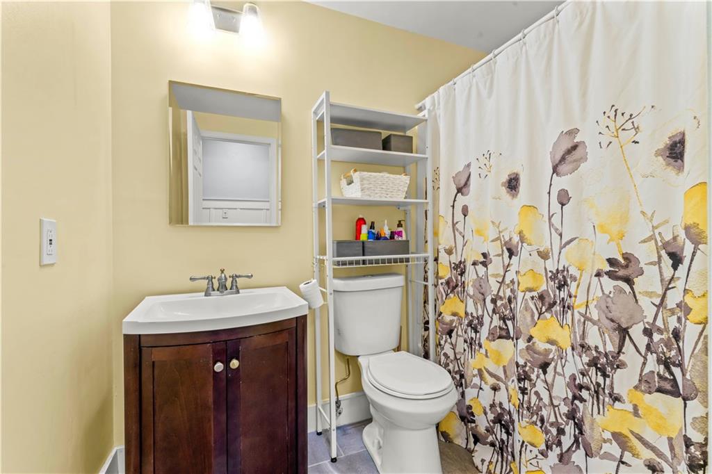 359 Hunting Creek Road Canonsburg, PA 15317 - Photo 19 of 39 a bathroom with a sink toilet and shower
