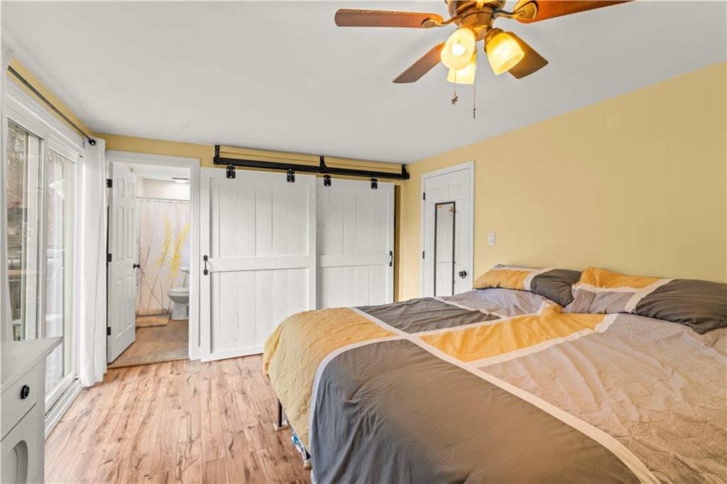 359 Hunting Creek Road Canonsburg, PA 15317 - Photo 21 of 39 a bedroom with a bed and a chandelier