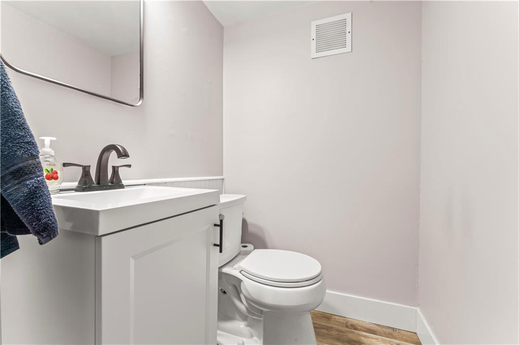 359 Hunting Creek Road Canonsburg, PA 15317 - Photo 27 of 39 a bathroom with a sink a toilet and mirror