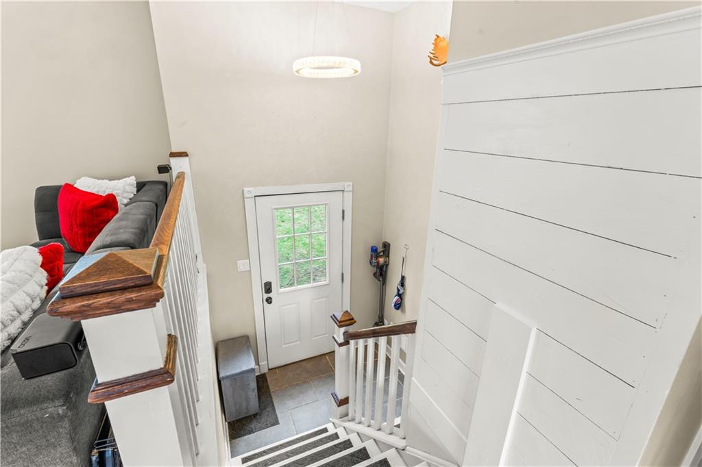 359 Hunting Creek Road Canonsburg, PA 15317 - Photo 6 of 39 a view of a hallway with couch and wooden floor