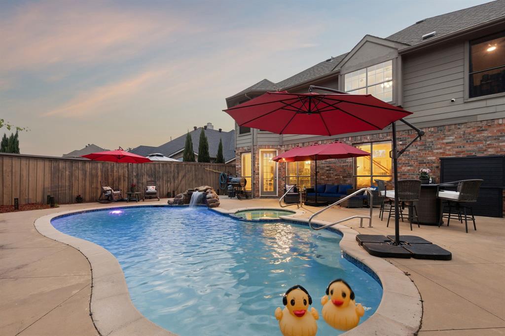129 Timberbluff Lane Murphy, TX 75094 - Photo 3 of 34 a view of a swimming pool with a patio