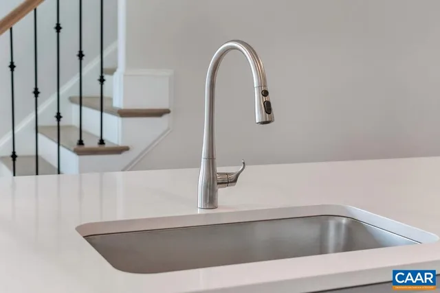 a bedroom with a bed and a night stand