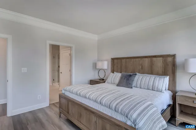 a front view of a house with a garden and yard