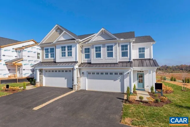 a view of kitchen with wooden floor washer and dryer