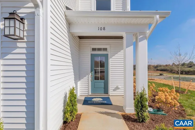 a bathroom with a sink mirror and vanity