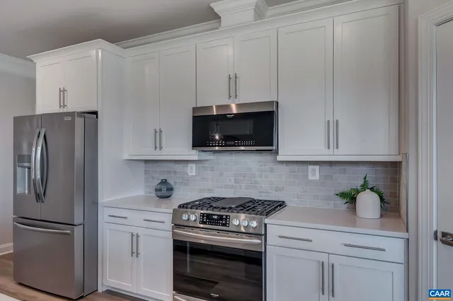 a view of an empty room and wooden floor
