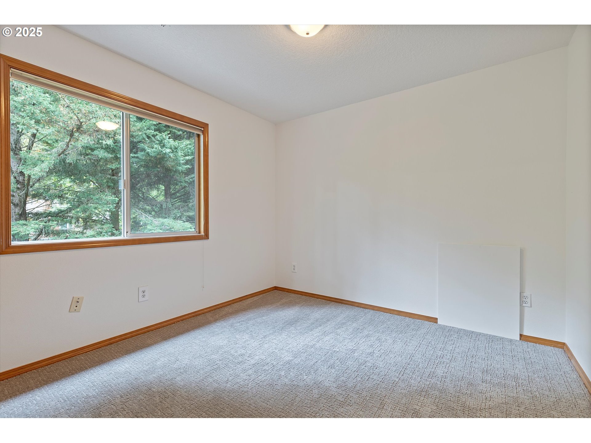 3475 Upper Drive Lake Oswego, OR 97035 - Photo 21 of 44 a view of an empty room with a window