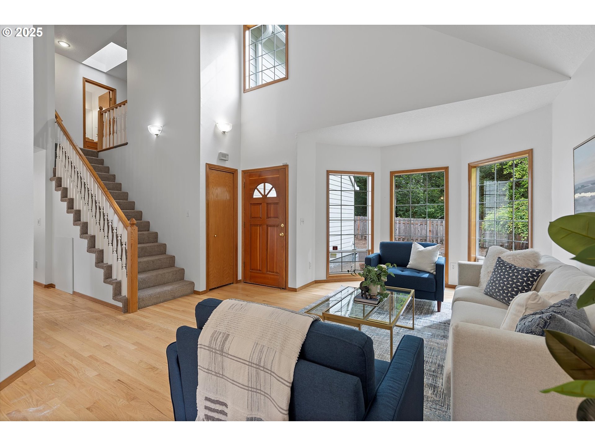 3475 Upper Drive Lake Oswego, OR 97035 - Photo 4 of 44 a living room with furniture and a floor to ceiling window