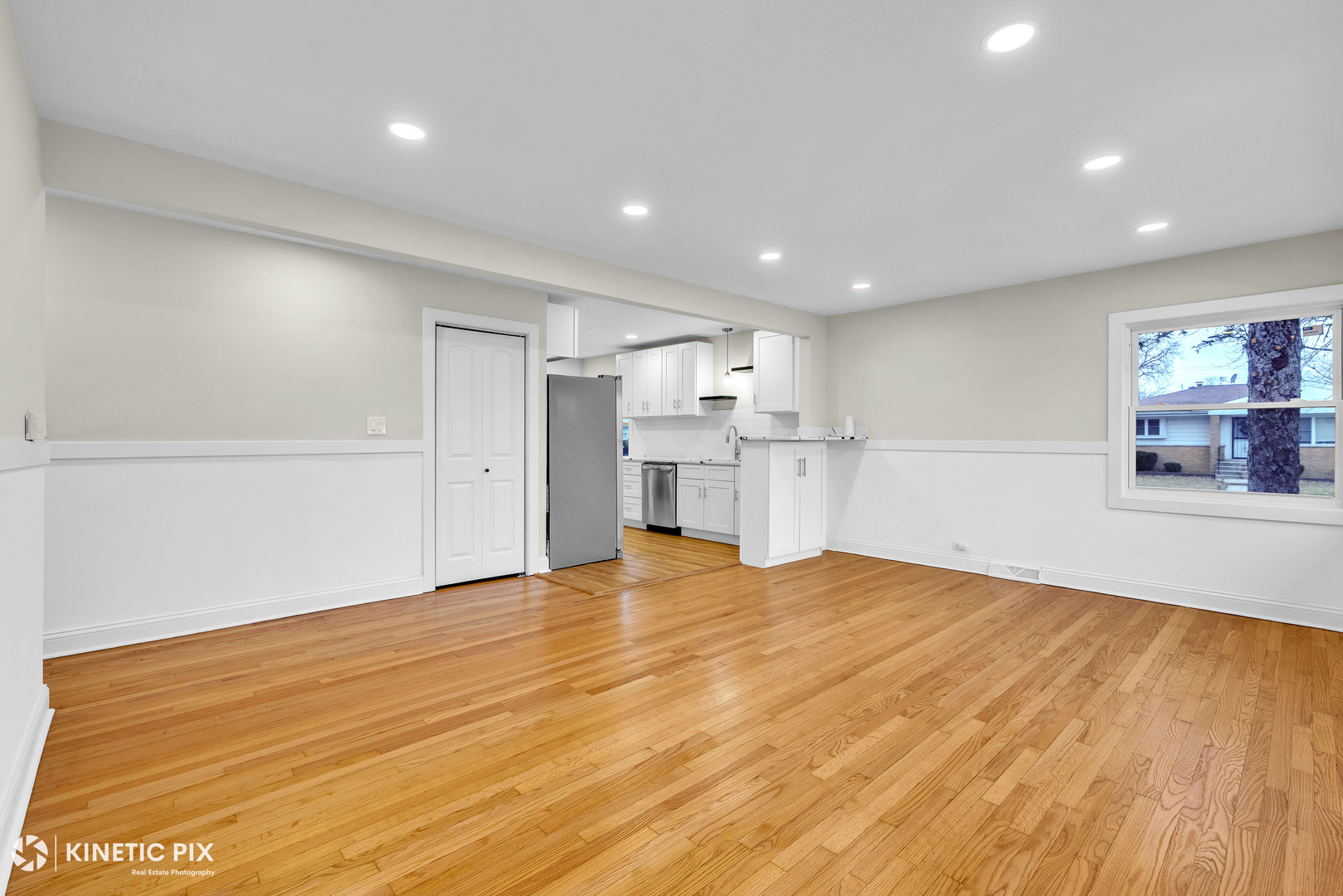 4938 West Randolph Street Hillside, IL 60162 - Photo 3 of 33 a view of empty room with wooden floor and kitchen