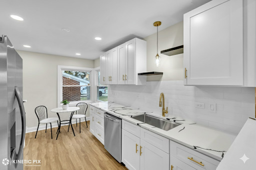 4938 West Randolph Street Hillside, IL 60162 - Photo 8 of 33 a kitchen with stainless steel appliances granite countertop a sink a stove a refrigerator and white cabinets with wooden floor
