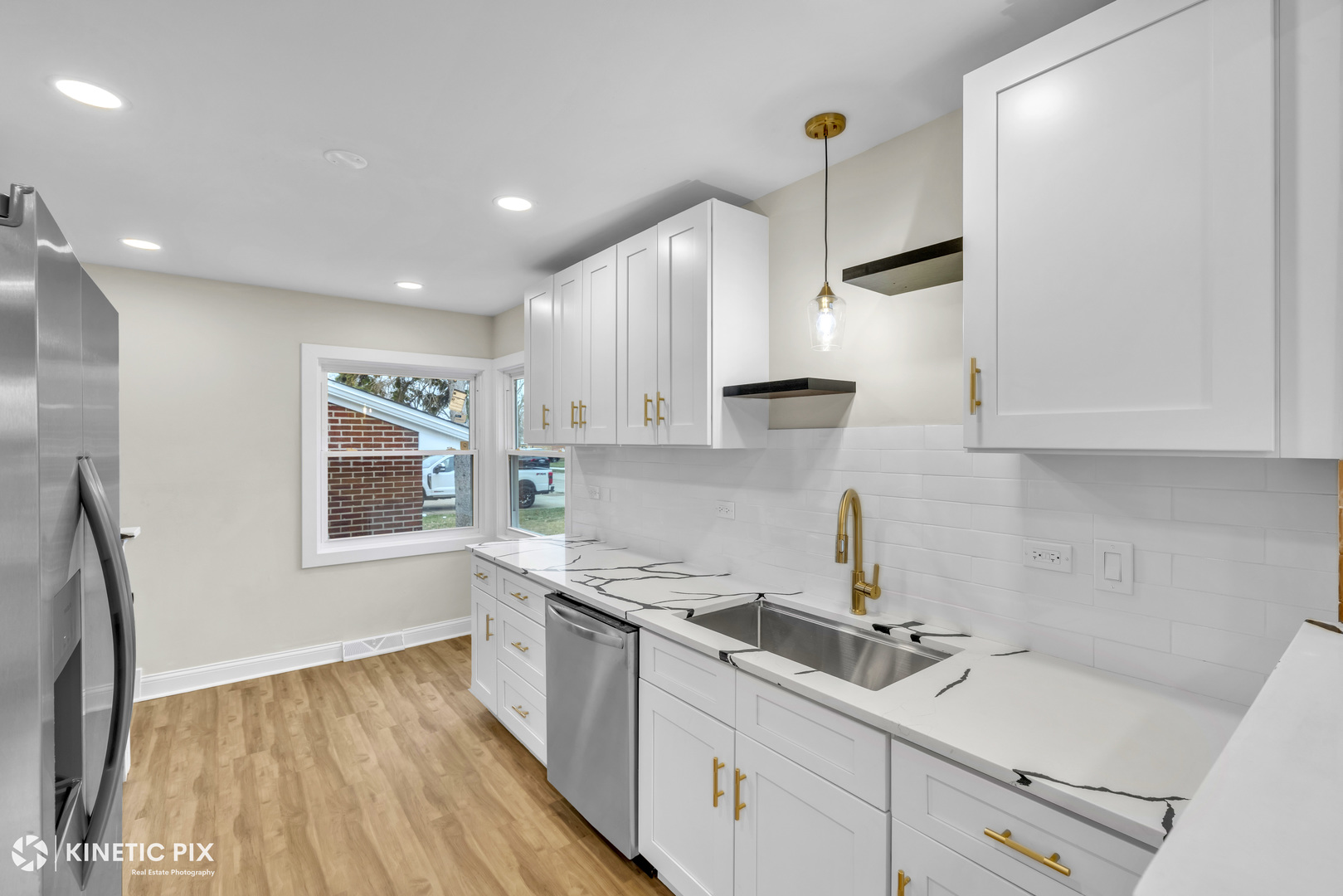 4938 West Randolph Street Hillside, IL 60162 - Photo 9 of 33 a kitchen with stainless steel appliances a sink stove and cabinets