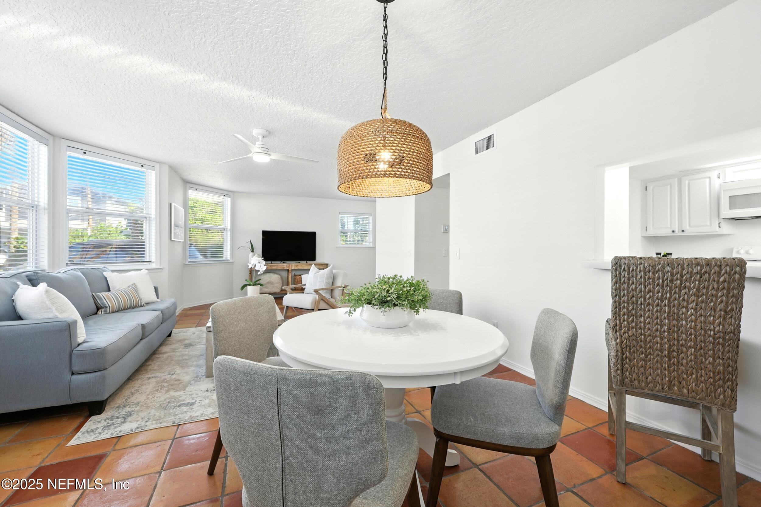 600 First Street Neptune Beach, FL 32266 - Photo 13 of 80 a living room with furniture and a flat screen tv