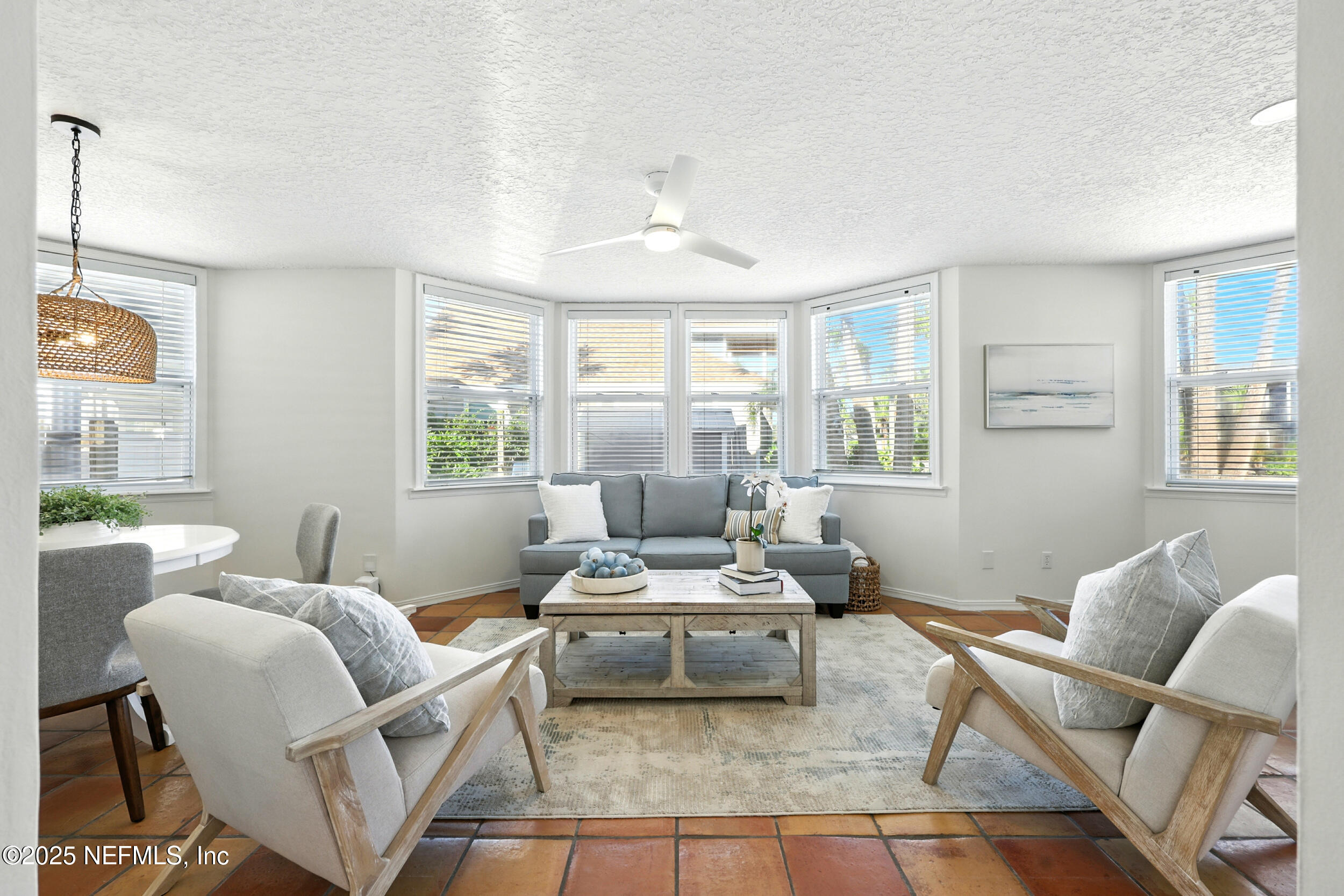 600 First Street Neptune Beach, FL 32266 - Photo 16 of 80 a living room with furniture and a large window