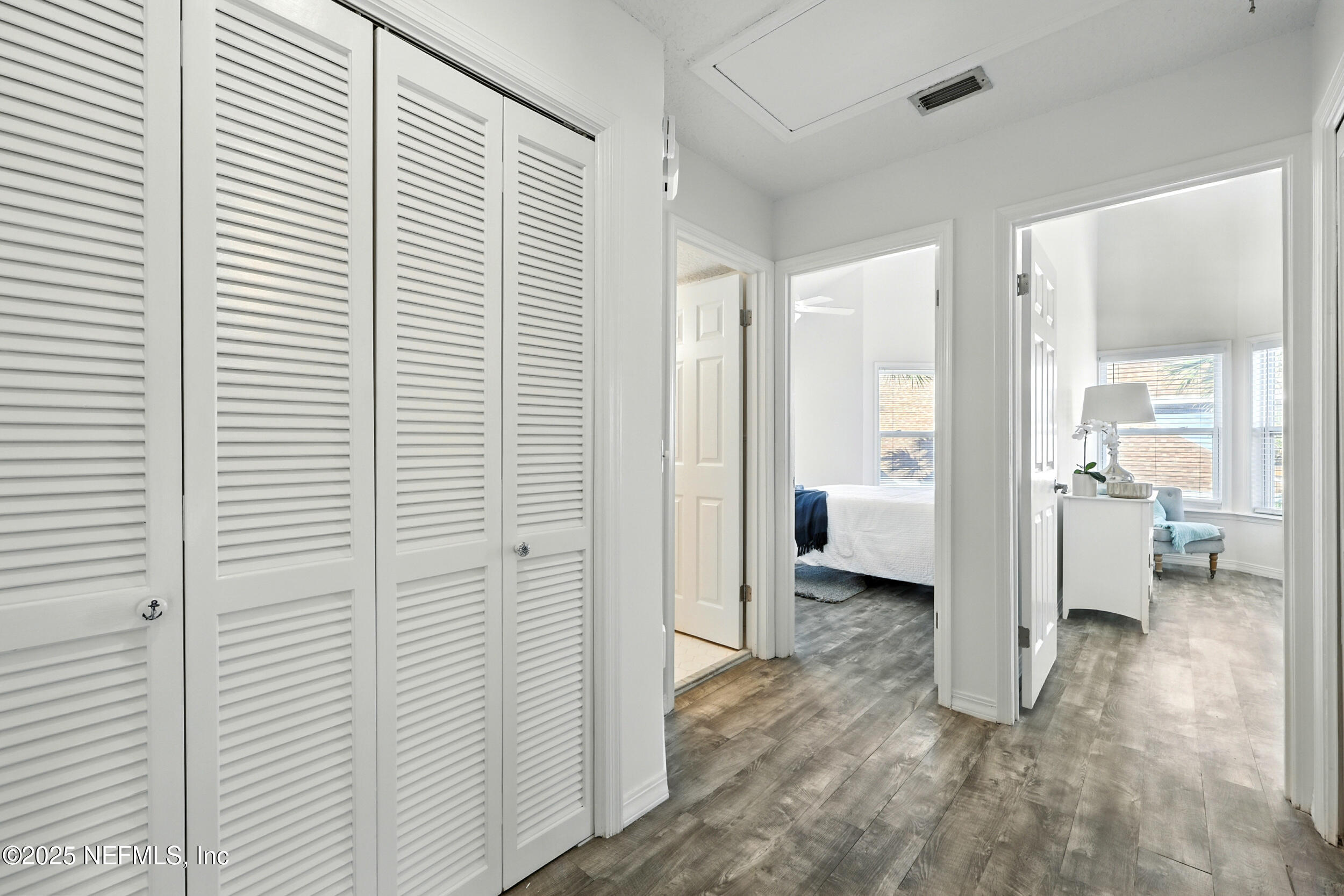 600 First Street Neptune Beach, FL 32266 - Photo 27 of 80 a view of a livingroom with wooden floor and a bathroom