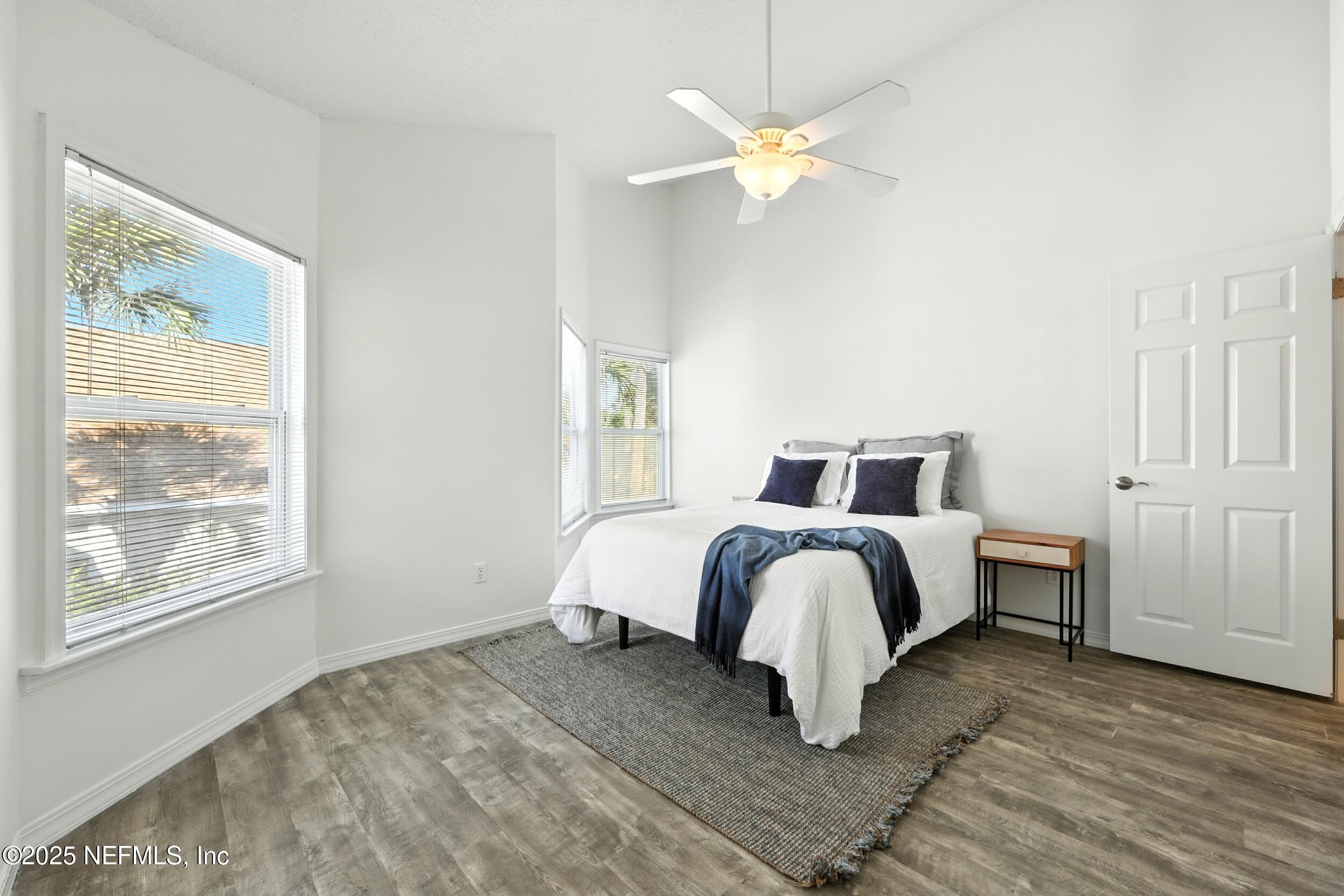 600 First Street Neptune Beach, FL 32266 - Photo 31 of 80 a bedroom with a bed and window