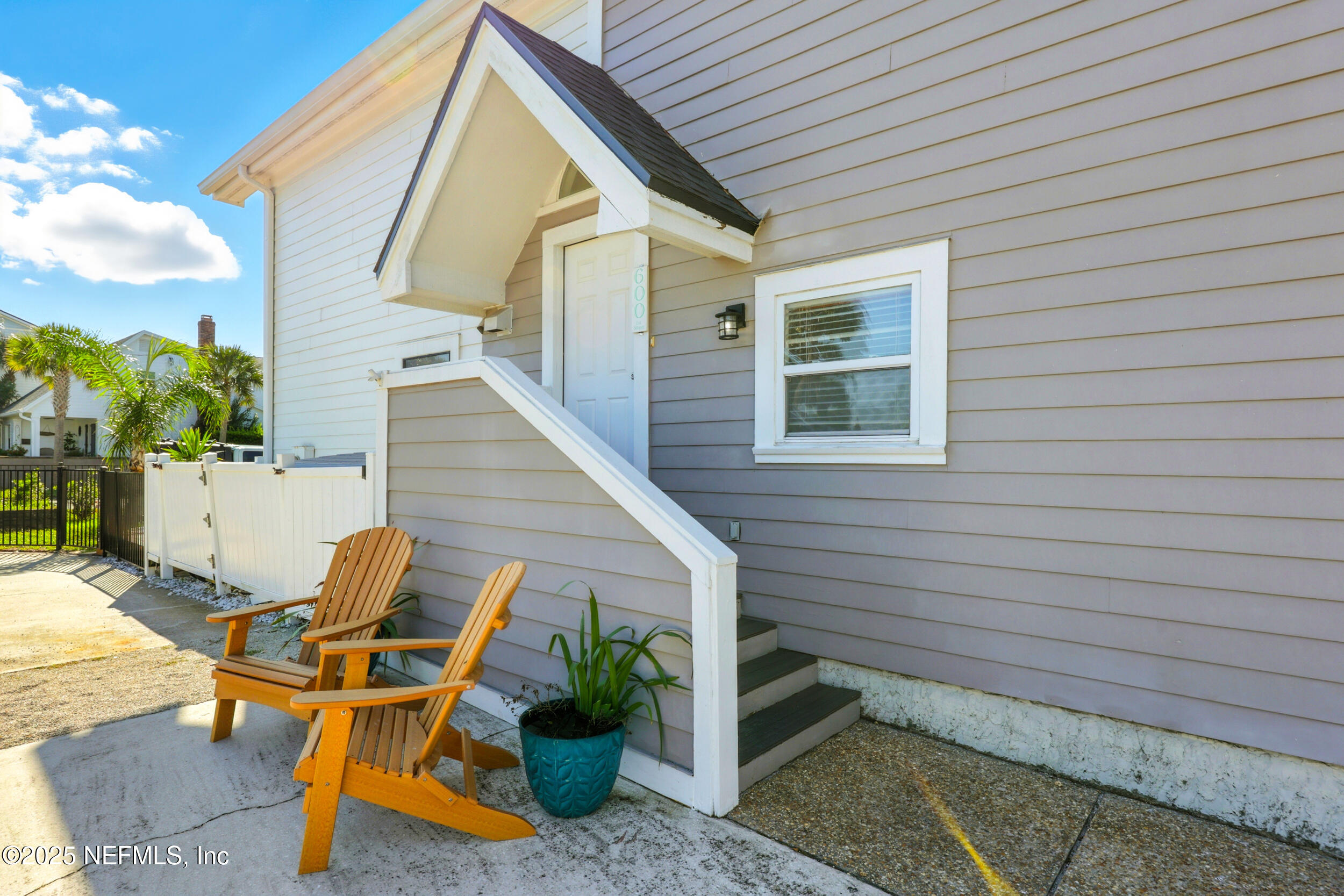 600 First Street Neptune Beach, FL 32266 - Photo 39 of 80 a view of backyard with outdoor seating and stairs