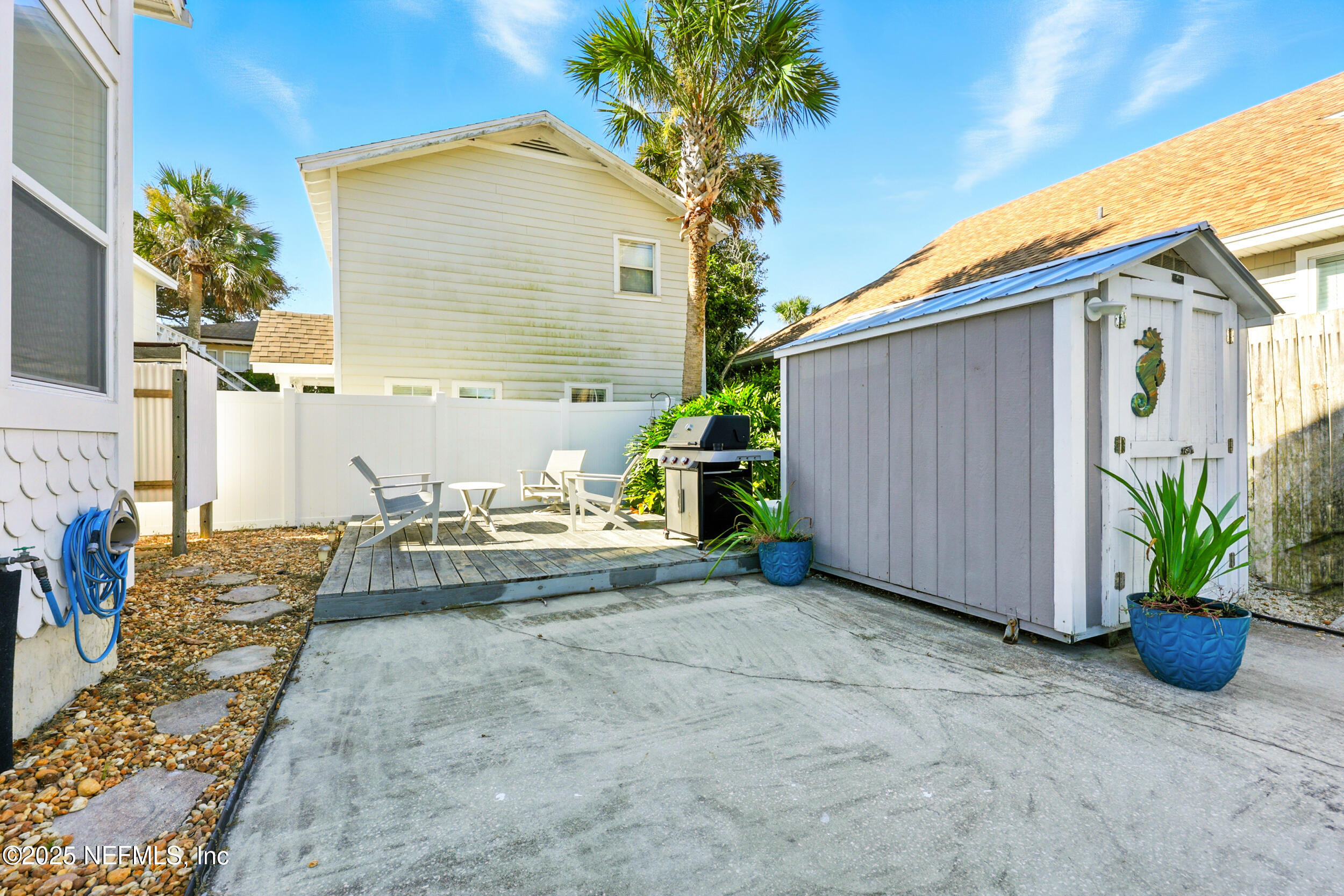 600 First Street Neptune Beach, FL 32266 - Photo 44 of 80 a view of a house with backyard and sitting area